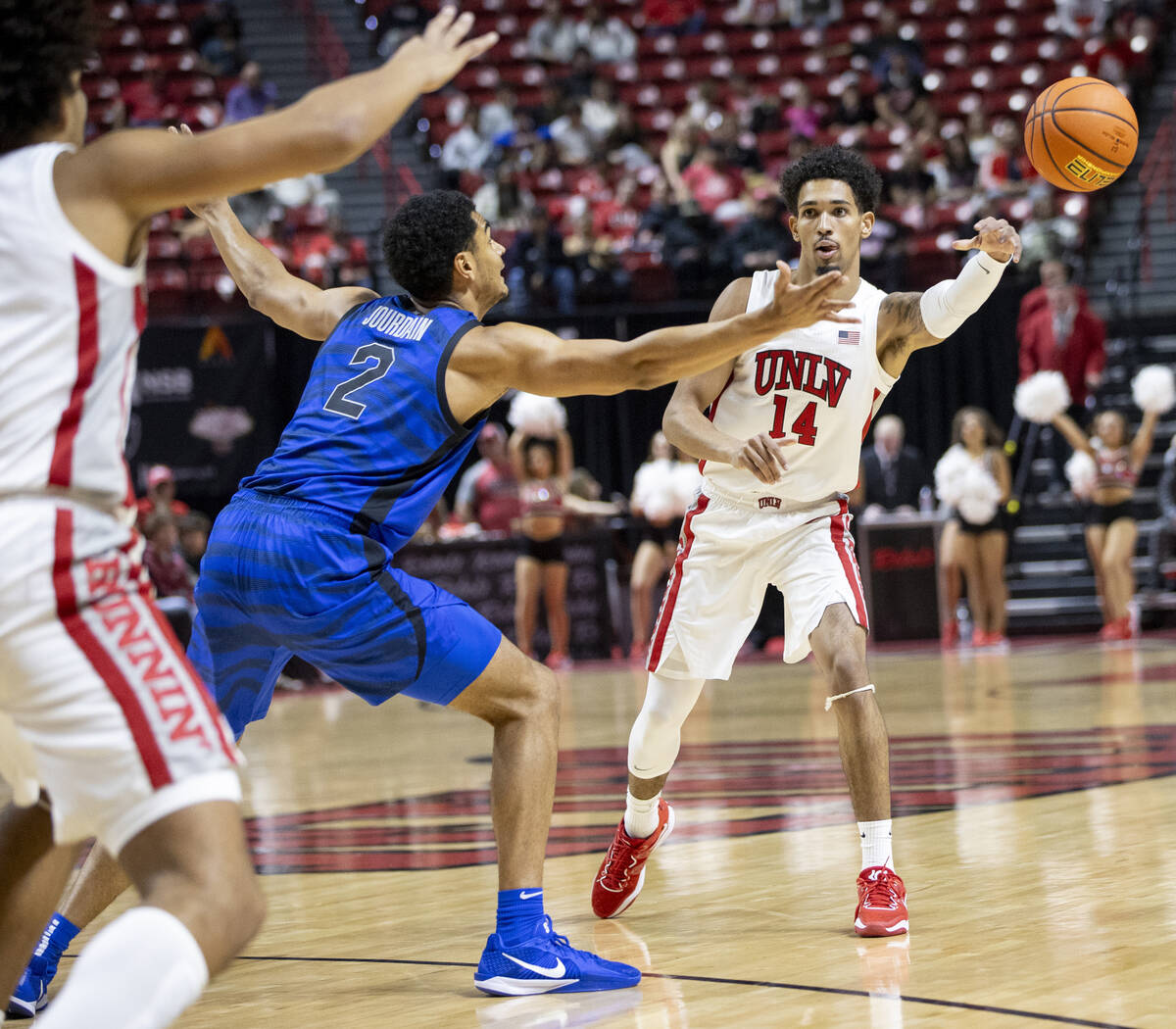 UNLV guard Jailen Bedford (14) passes the ball during the college basketball game against the M ...