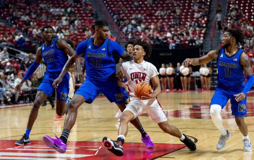 UNLV guard Dedan Thomas Jr. (11) rushes the paint during the college basketball game against th ...