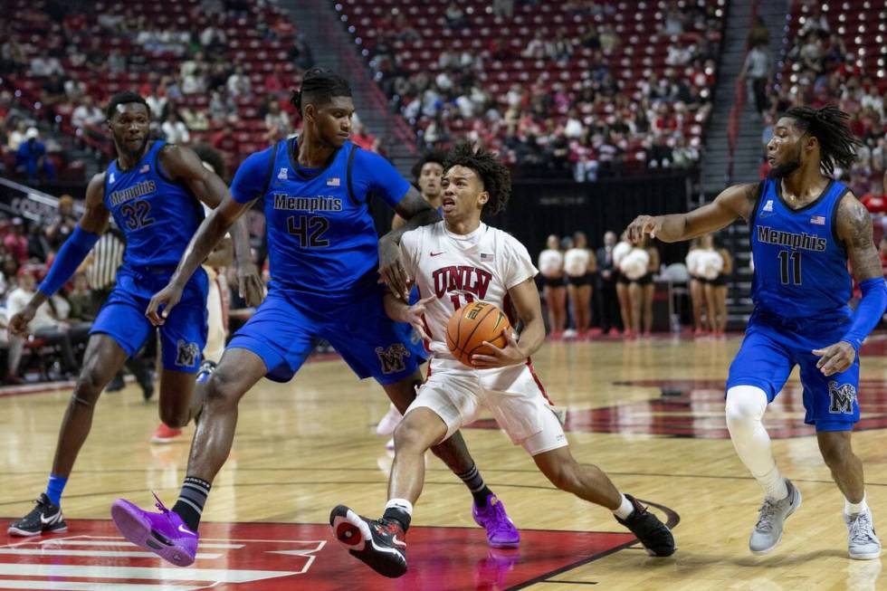 UNLV guard Dedan Thomas Jr. (11) rushes the paint during the college basketball game against th ...