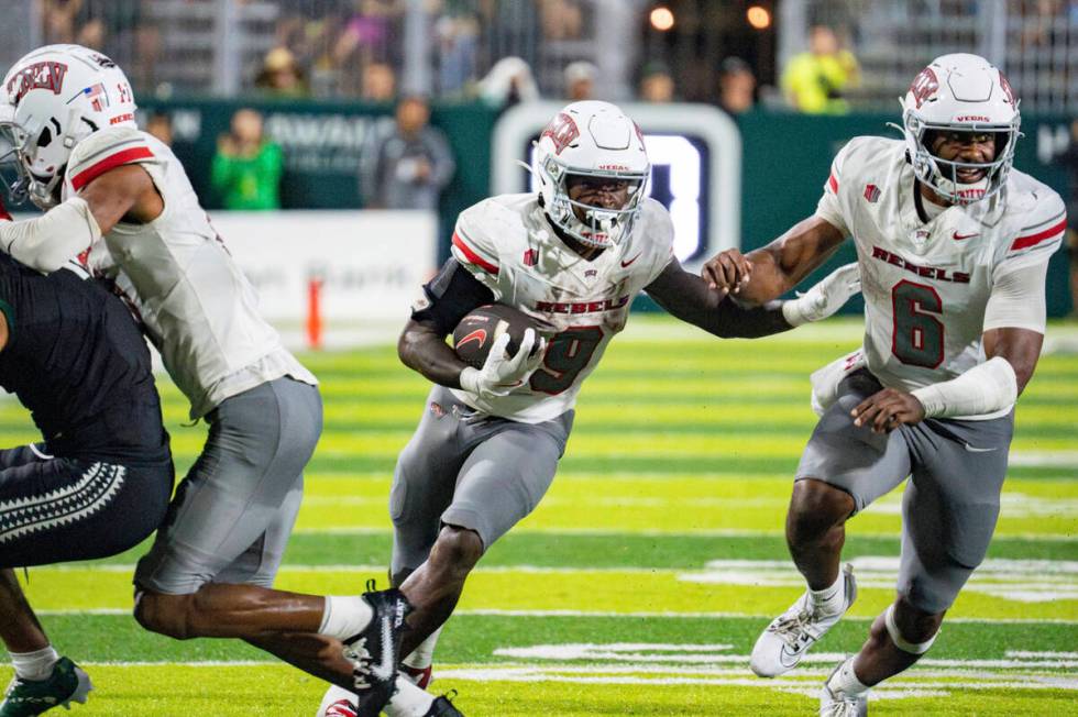 UNLV running back Jai'Den Thomas (9) runs the ball during the second half of an NCAA college fo ...