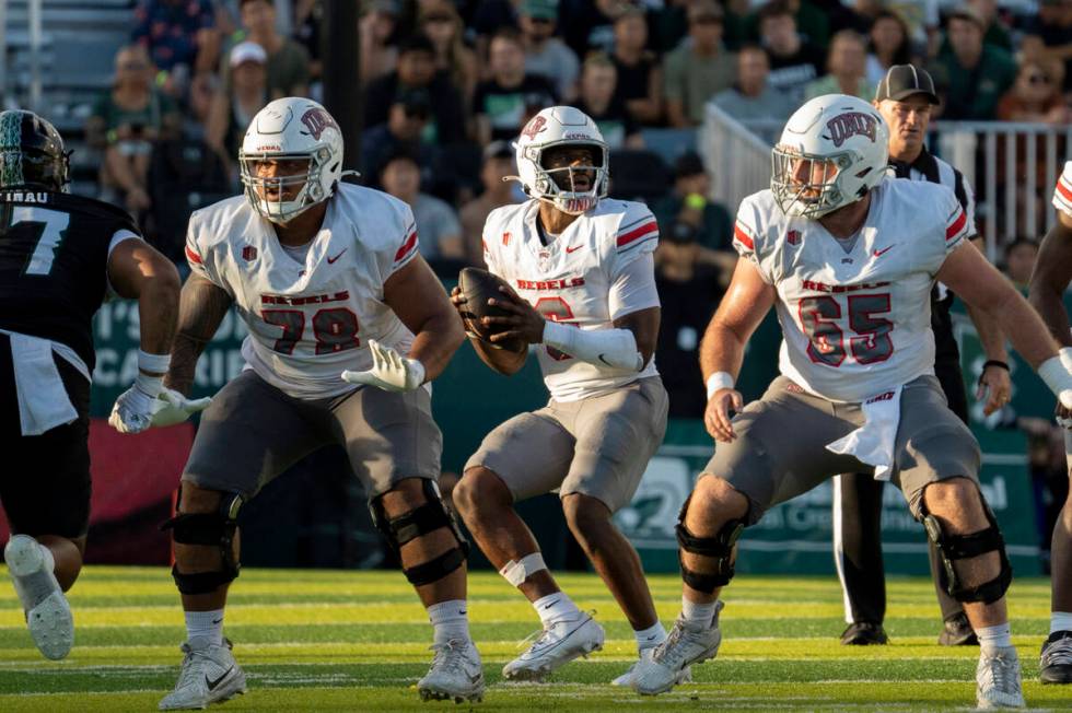 UNLV quarterback Hajj-Malik Williams (6) looks to throw the ball during the first half of an NC ...