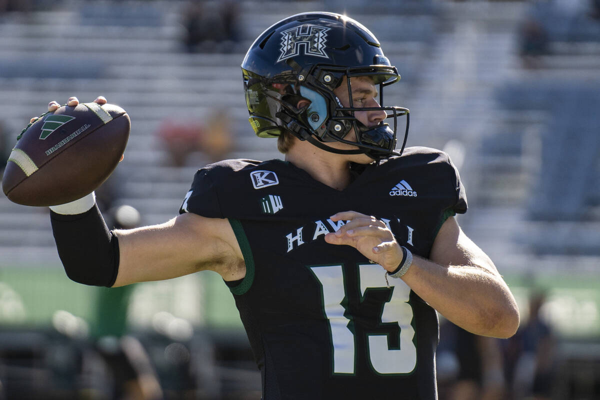 Hawaii quarterback Brayden Schager (13) warms up for an NCAA college football game against UNLV ...