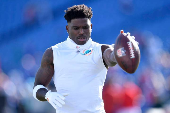 Miami Dolphins wide receiver Tyreek Hill warms up before an NFL football game against the Buffa ...