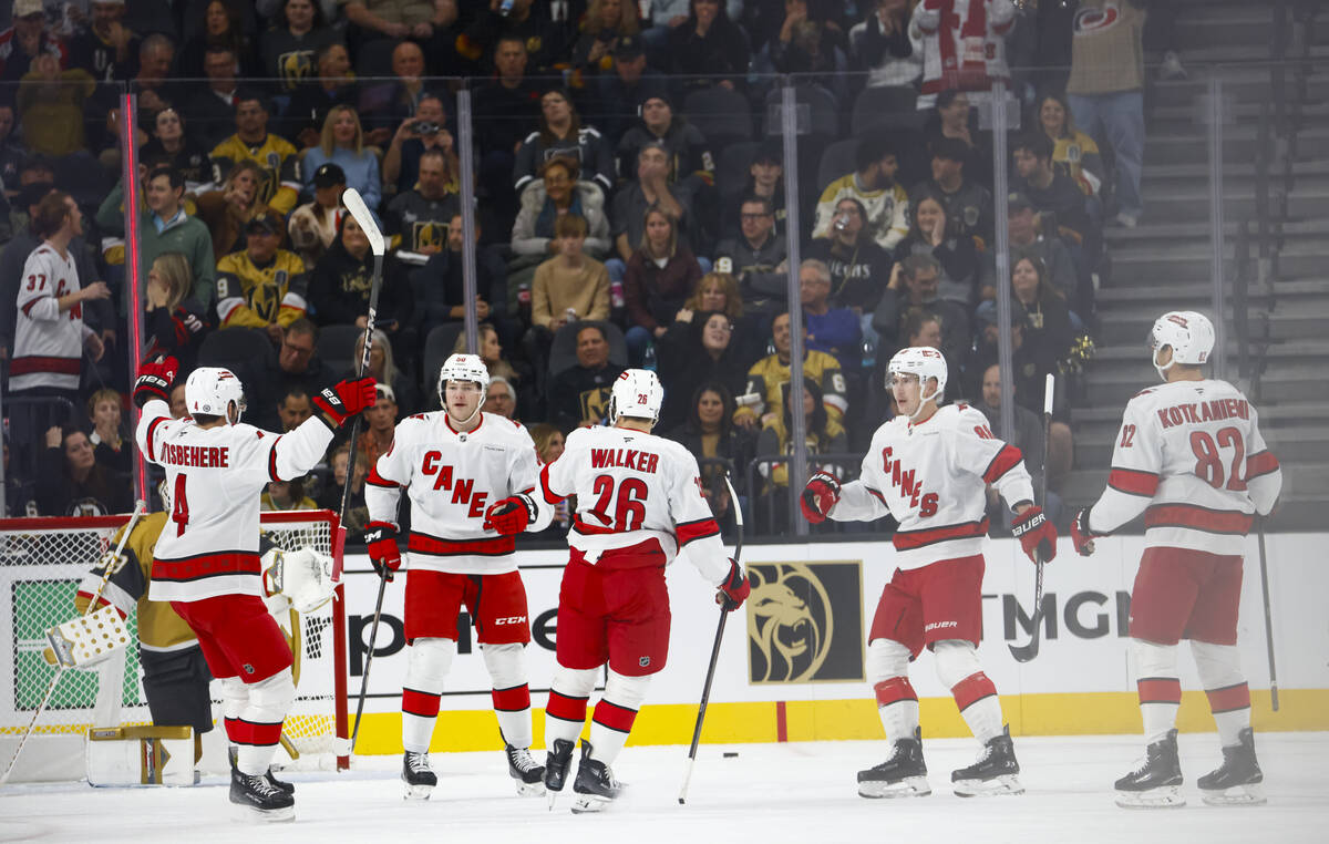 The Carolina Hurricanes celebrate after scoring against the Golden Knights during the first per ...