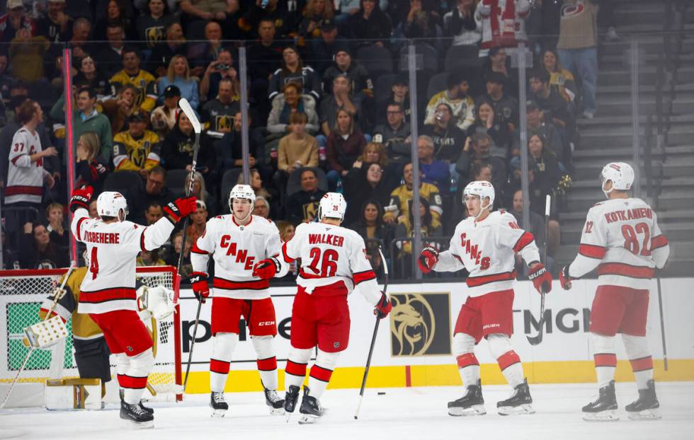 The Carolina Hurricanes celebrate after scoring against the Golden Knights during the first per ...