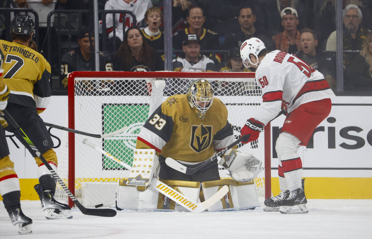 Carolina Hurricanes left wing Eric Robinson (50) scores a goal against Golden Knights goaltende ...