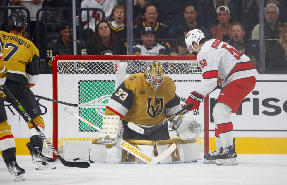 Carolina Hurricanes left wing Eric Robinson (50) scores a goal against Golden Knights goaltende ...