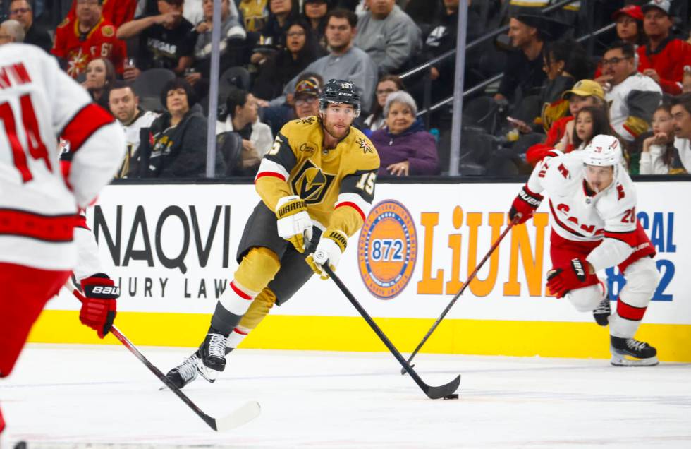 Golden Knights defenseman Noah Hanifin (15) skates with the puck against the Carolina Hurricane ...