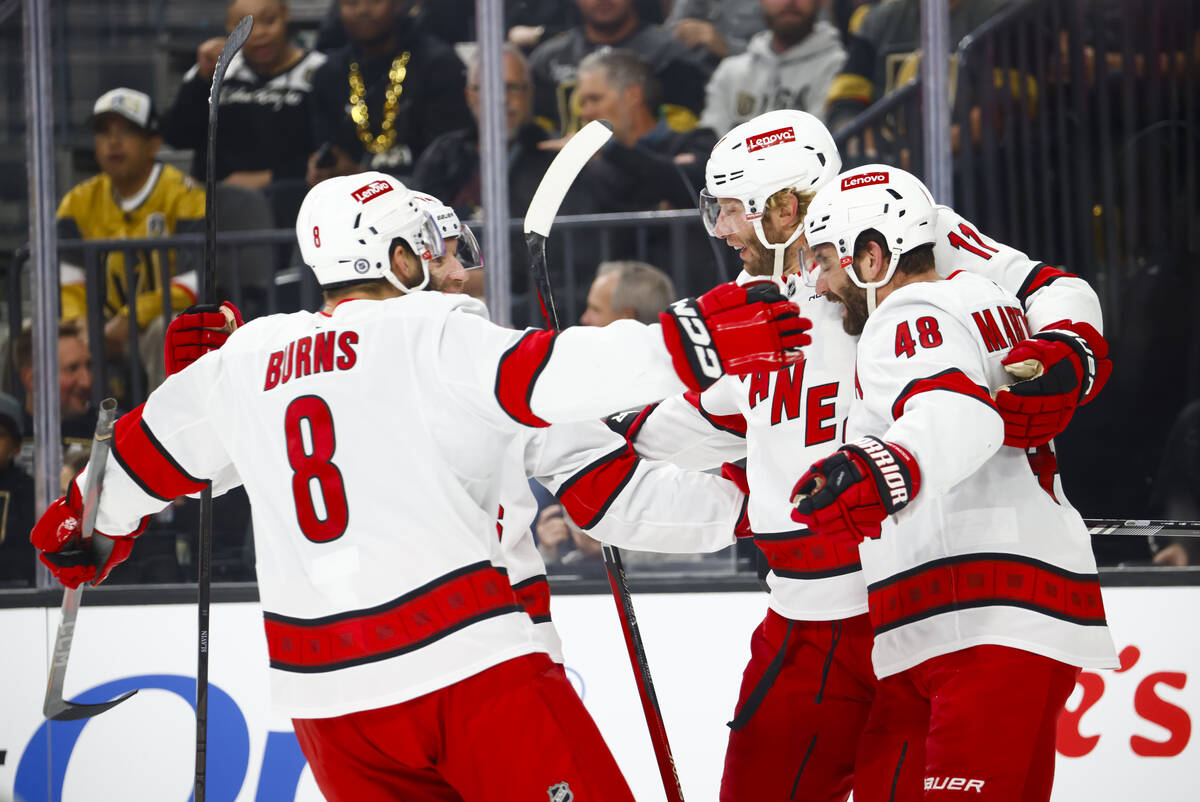 The Carolina Hurricanes celebrate after scoring against the Golden Knights during the second pe ...