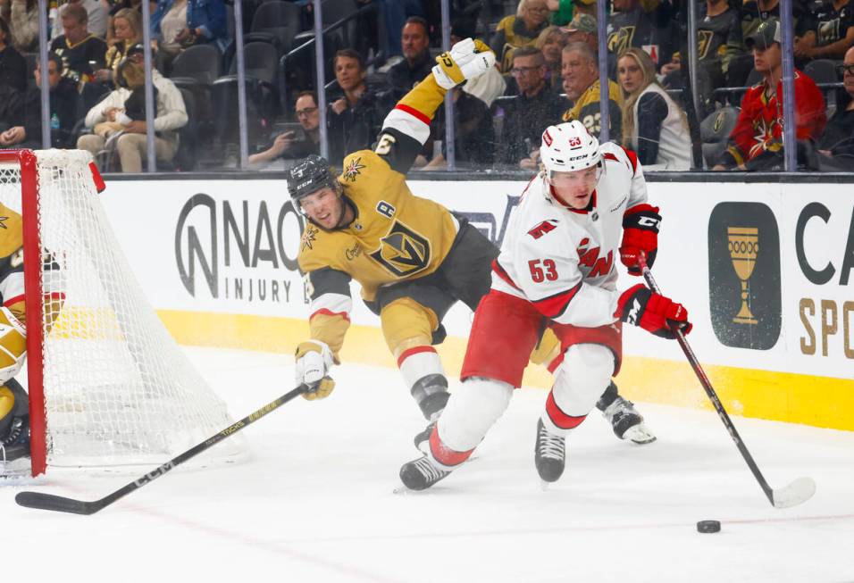 Carolina Hurricanes right wing Jackson Blake (53) skates with the puck under pressure from Gold ...