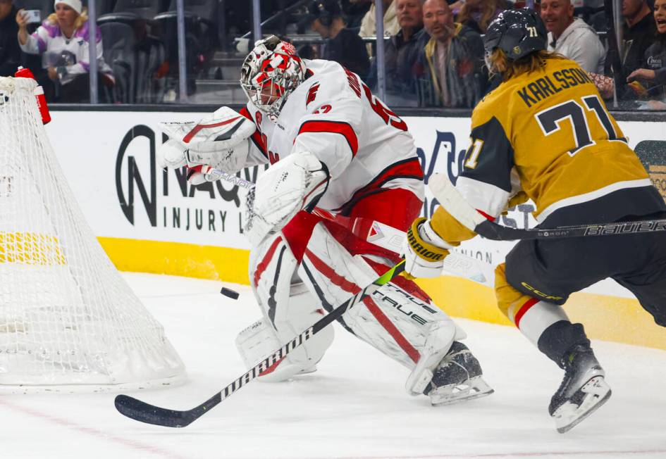 Carolina Hurricanes goaltender Pyotr Kochetkov (52) tries to save the puck outside of the creas ...