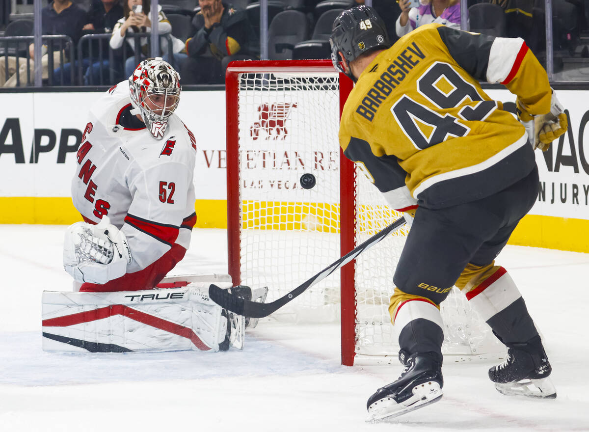 Golden Knights center Ivan Barbashev (49) scores a goal against Carolina Hurricanes goaltender ...