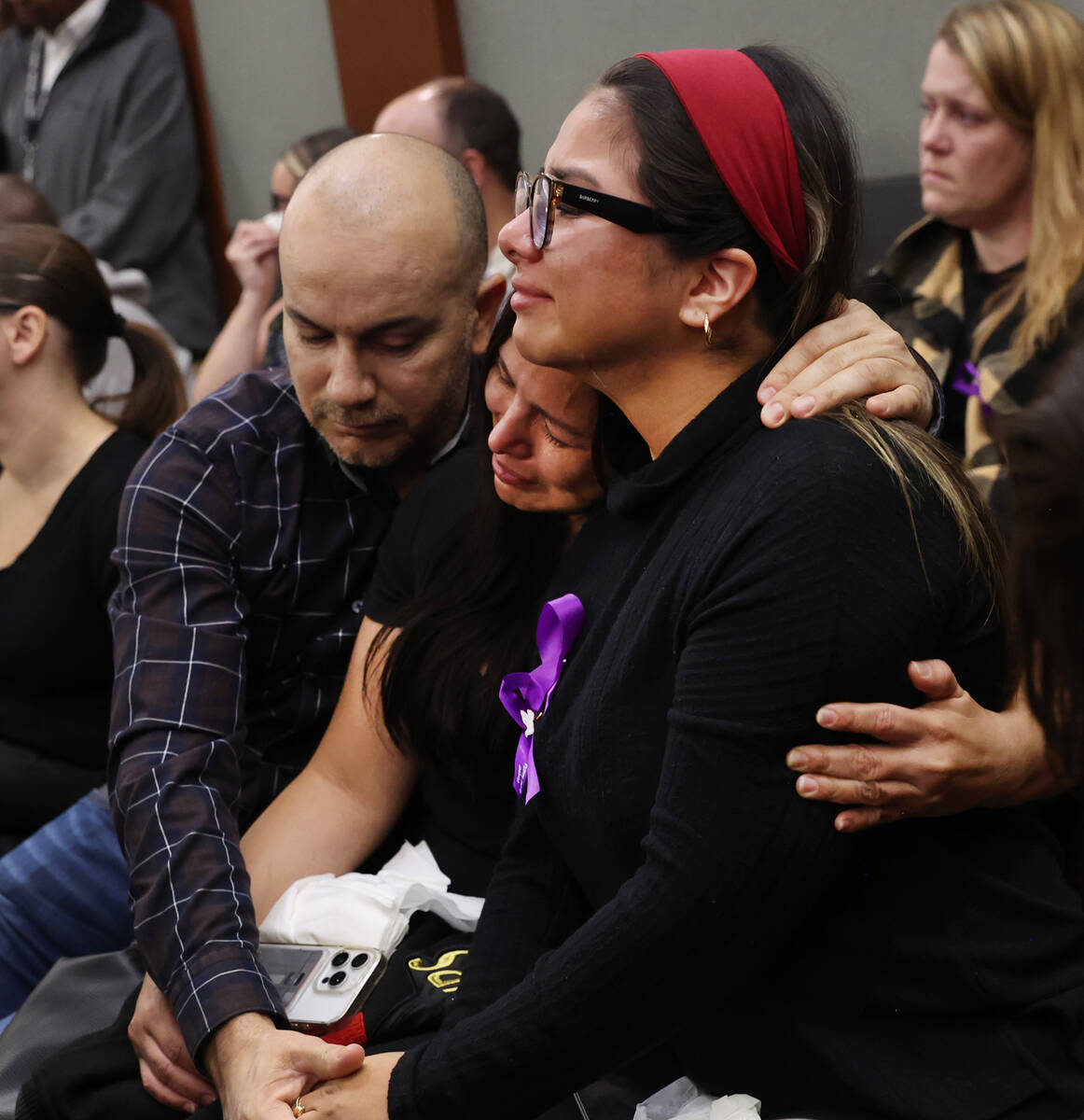 Friends of DUI crash victims family comfort each other as they attend the sentencing of Darryl ...