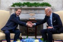 President Joe Biden shakes hands with Israel's President Isaac Herzog, left, during a meeting i ...