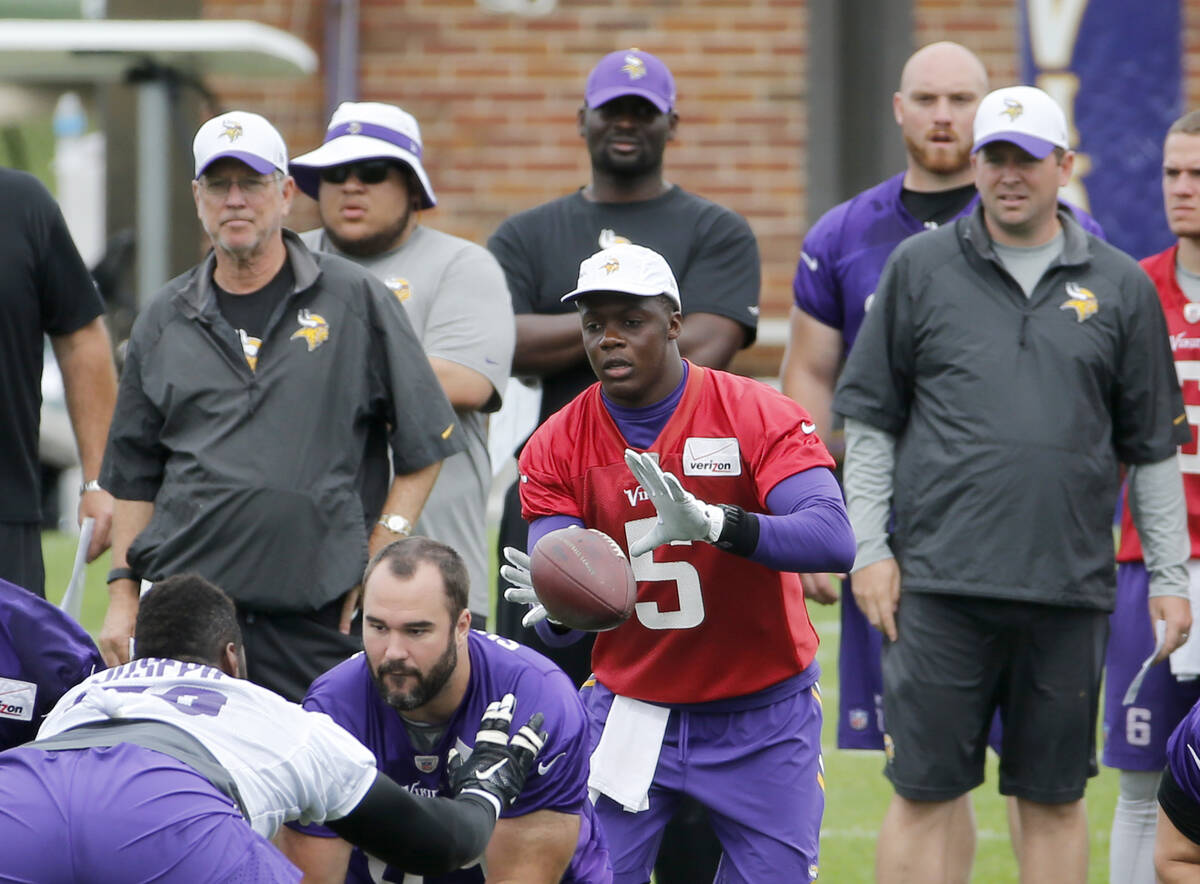 Minnesota Vikings quarterback Teddy Bridgewater (5) takes a snap from center as offensive coor ...