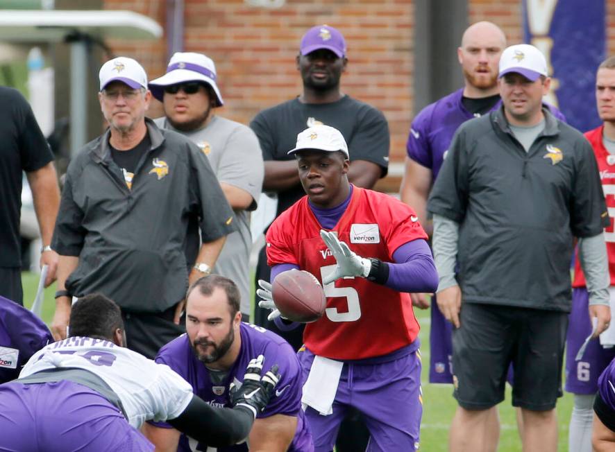 Minnesota Vikings quarterback Teddy Bridgewater (5) takes a snap from center as offensive coor ...