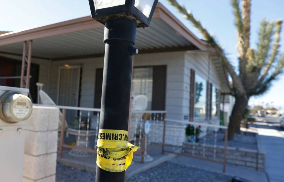 Crime scene tape is seen near the house where Monique Gilbertson's body was found, on Monday, N ...