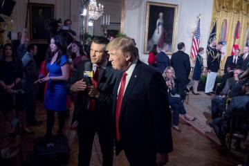 President Donald Trump appears on Fox & Friends co-host Pete Hegseth at a Wounded Warrior Proje ...