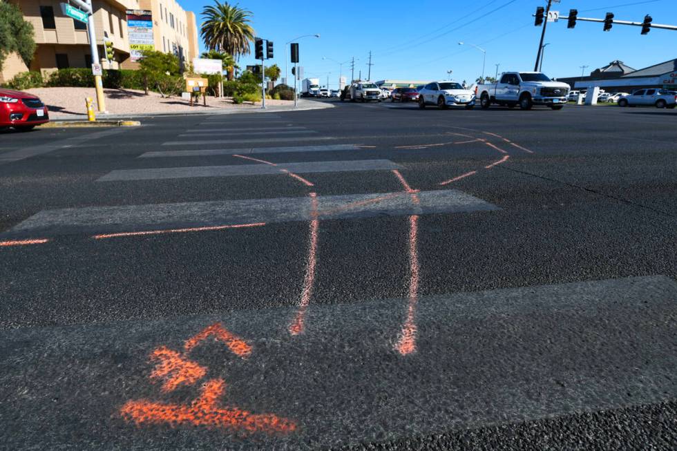 Markings are seen on the pavement at the scene of a fatal car accident at the intersection of F ...