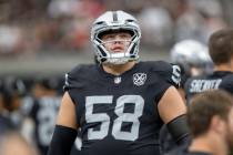 Raiders guard Jackson Powers-Johnson (58) on the sideline before an NFL game against the Kansas ...