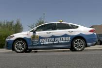 A Las Vegas Valley Water District water patrol car on a Henderson street as part of a water was ...