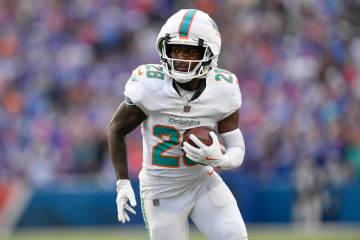 Miami Dolphins running back De'Von Achane (28) runs with the ball during the second half of an ...