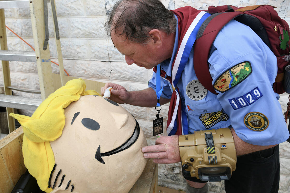 Brian McLaughlin from Los Angles torches up his “Vault Boy" head during the Fallout ...