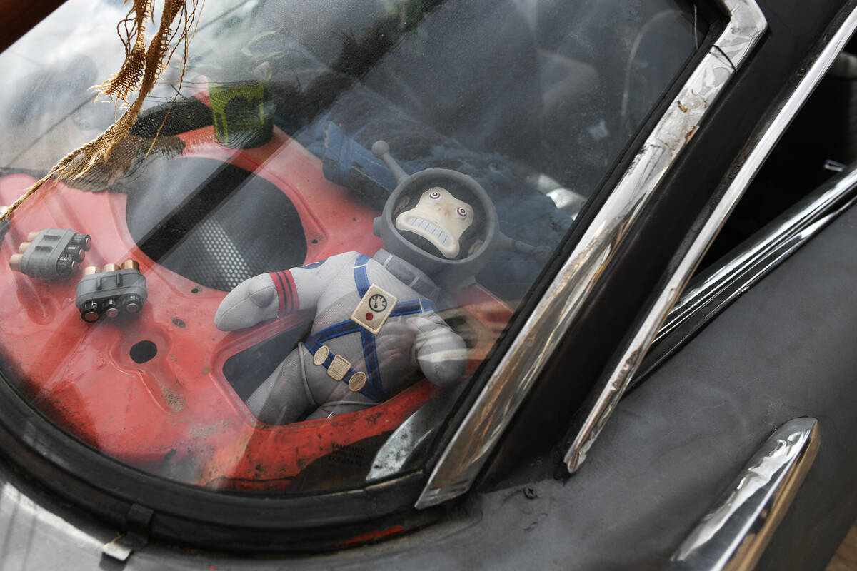 A Jangles the Moon Monkey doll is seen in a car during the Fallout Fan Celebration Saturday, No ...