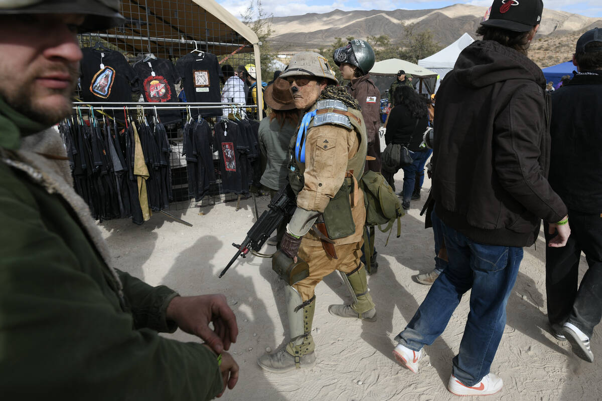 Fans in costume walk through the vendor area during the Fallout Fan Celebration Saturday, Novem ...