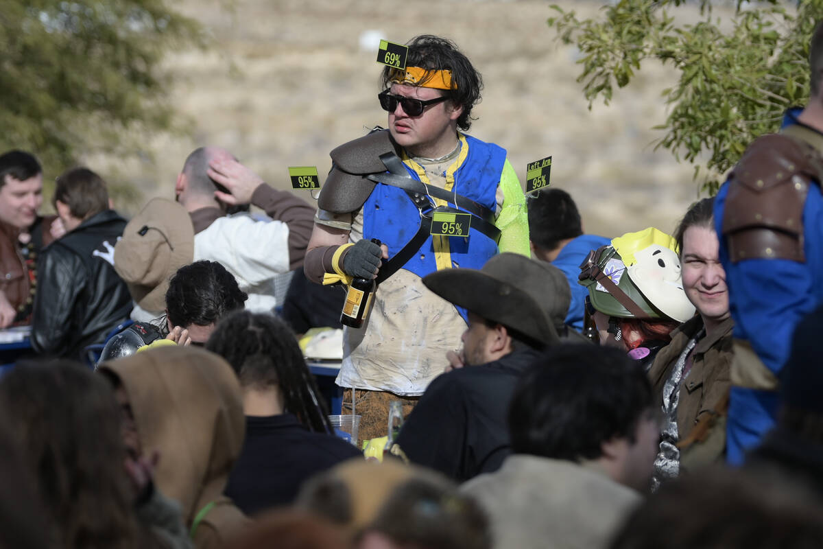 An attendee wears numbers representing in-game damage during the Fallout Fan Celebration Saturd ...