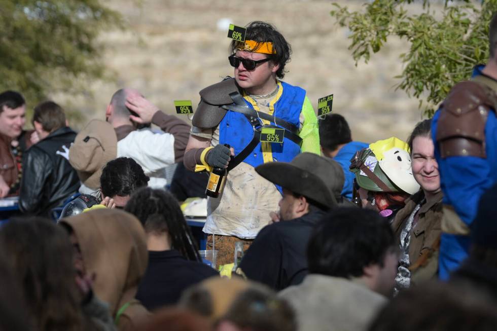 An attendee wears numbers representing in-game damage during the Fallout Fan Celebration Saturd ...