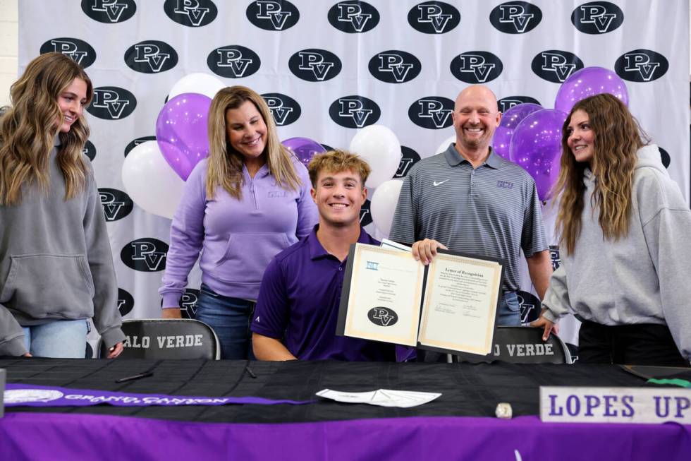 Palo Verde baseball player Tanner Johns shows his signed financial aid agreements for Grand Can ...