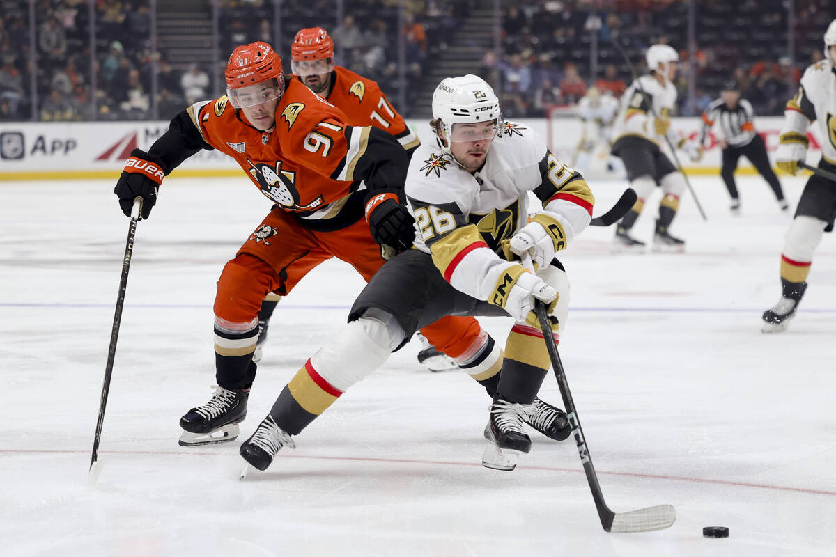 Vegas Golden Knights right wing Alexander Holtz, right, and Anaheim Ducks center Leo Carlsson v ...