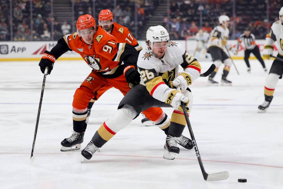 Vegas Golden Knights right wing Alexander Holtz, right, and Anaheim Ducks center Leo Carlsson v ...