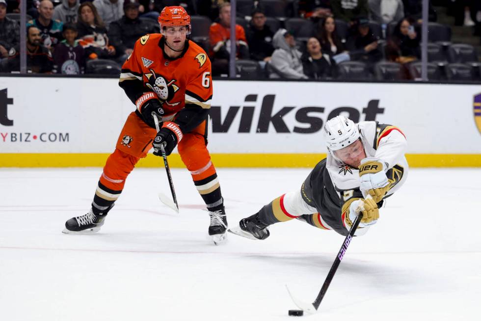 Vegas Golden Knights center Jack Eichel, right, shoots against Anaheim Ducks defenseman Brian D ...