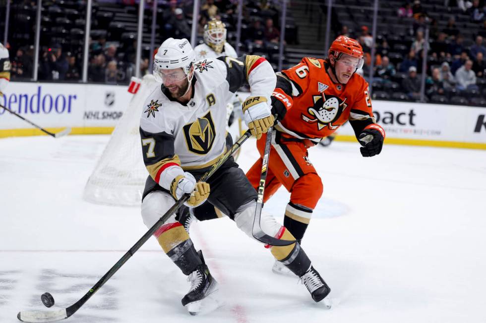 Vegas Golden Knights defenseman Alex Pietrangelo, left, and Anaheim Ducks left wing Brock McGin ...