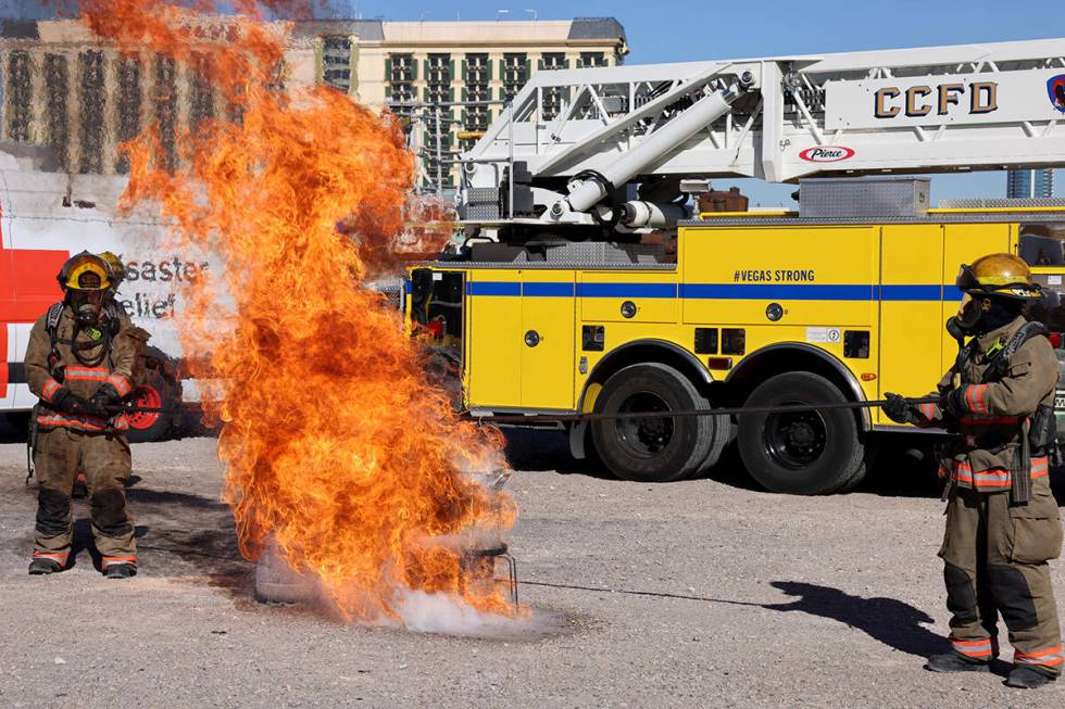 FILE - Firefighters perform a holiday cooking safety demonstration using a frozen turkey in hot ...