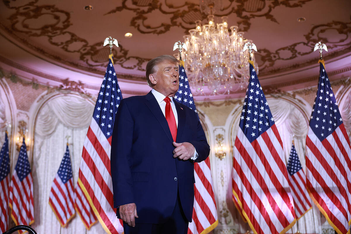 Donald Trump arrives on stage to speak during an event at his Mar-a-Lago home. (Joe Raedle/Gett ...