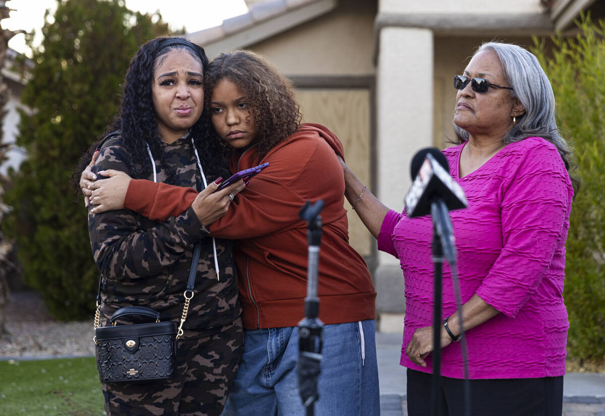 Diane Wright, left, gets a hug from her niece, Isabella Durham, after talking about her brother ...