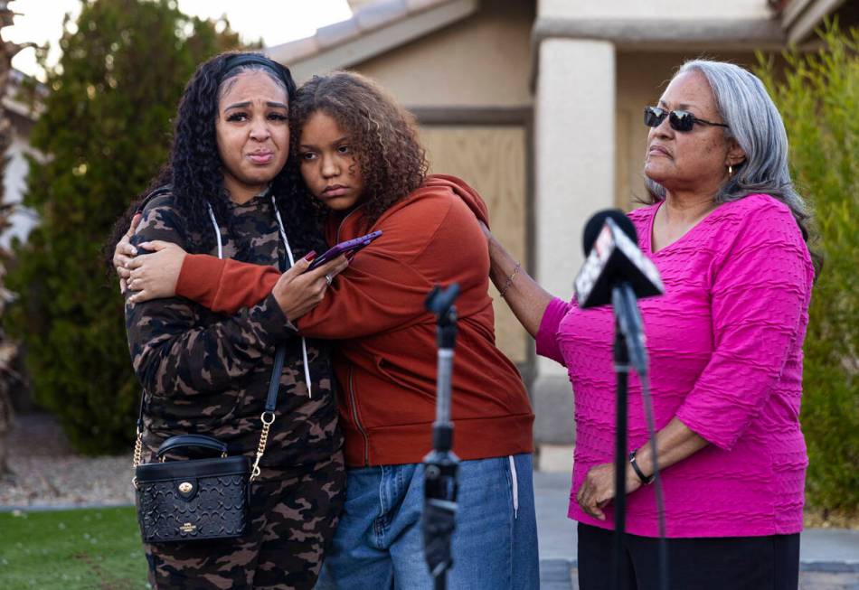 Diane Wright, left, gets a hug from her niece, Isabella Durham, after talking about her brother ...