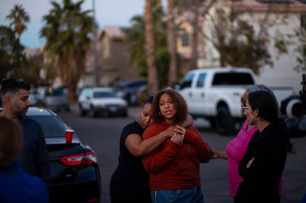 Isabella Durham is comforted by her mother, Ailin Averhoff, while talking about her father, Bra ...