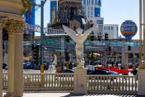 Traffic moves along Flamingo Road at Las Vegas Boulevard about F1 infrastructure along the Las ...