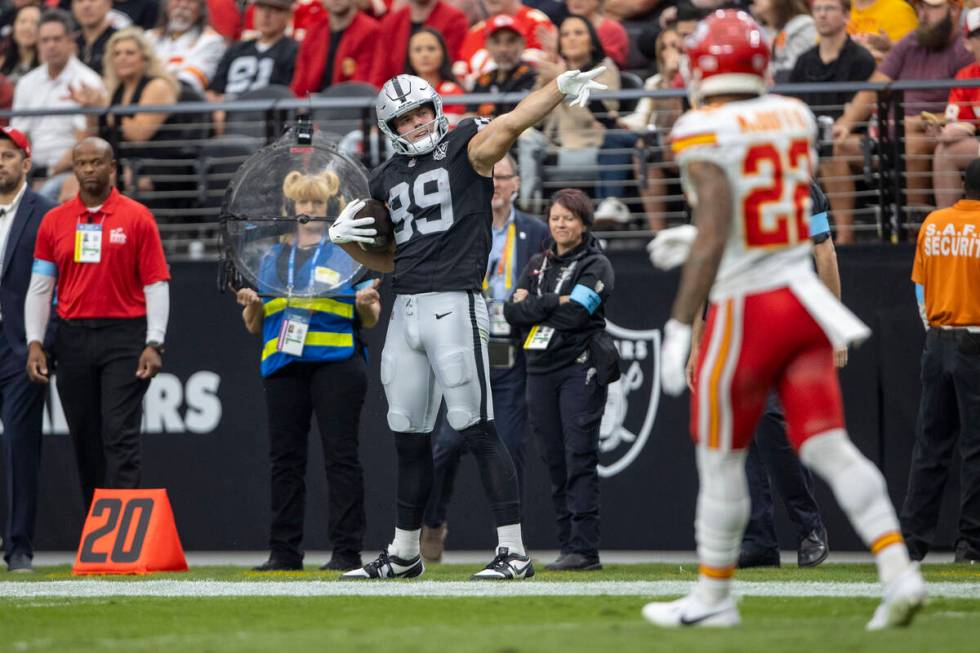 Raiders tight end Brock Bowers (89) signals for a first down after a catch during the first hal ...