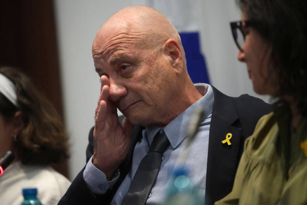 Louis Har, a former Israeli hostage, gets emotional during a press conference in Rome, Thursday ...