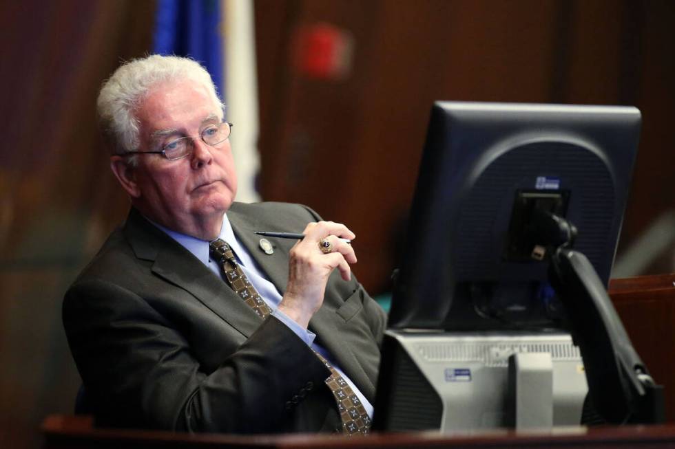 Nevada Assembly Speaker John Hambrick, R-Las Vegas, listens to Assembly floor discussion at the ...