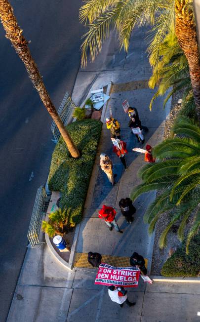 Culinary Local 226 workers on strike on the sidewalk outside the self park garage outside the V ...