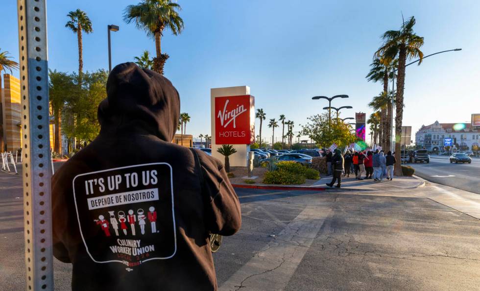 Culinary Local 226 workers on strike on the sidewalk near the main entrance outside the Virgin ...