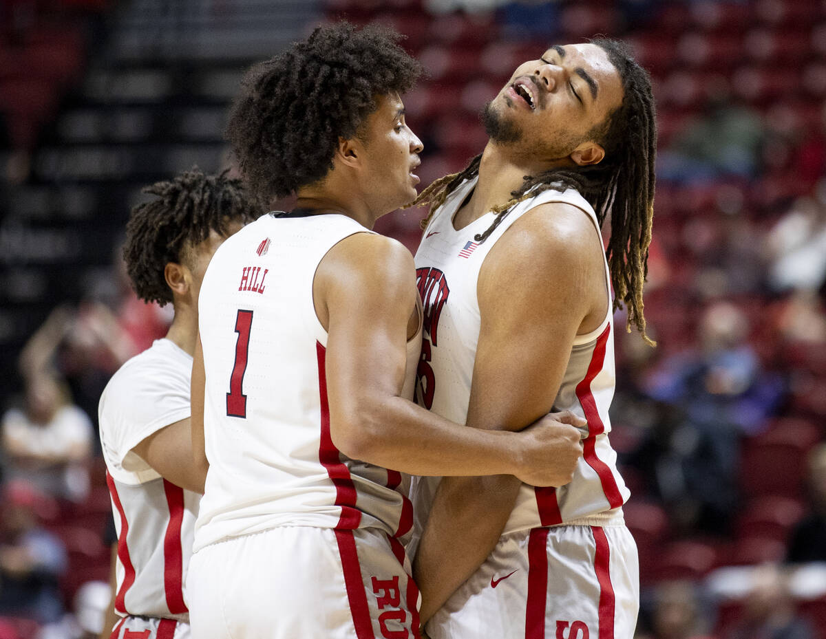 UNLV forward Jalen Hill (1) comforts forward Jeremiah Cherry, right, as Cherry receives his six ...