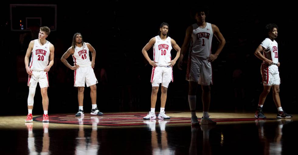 UNLV guard Julian Rishwain (20), forward Jeremiah Cherry (45), guard Jaden Henley (10), forward ...