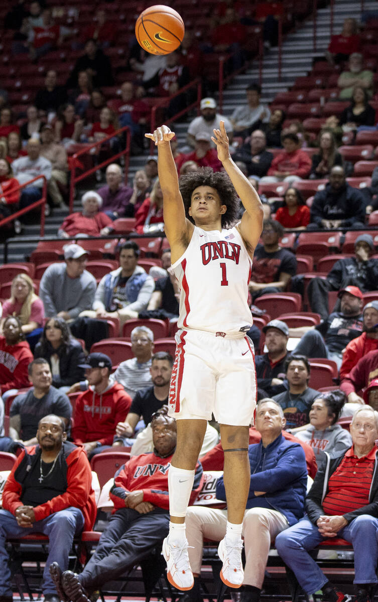 UNLV forward Jalen Hill (1) attempts a three-point shot during the college basketball game agai ...